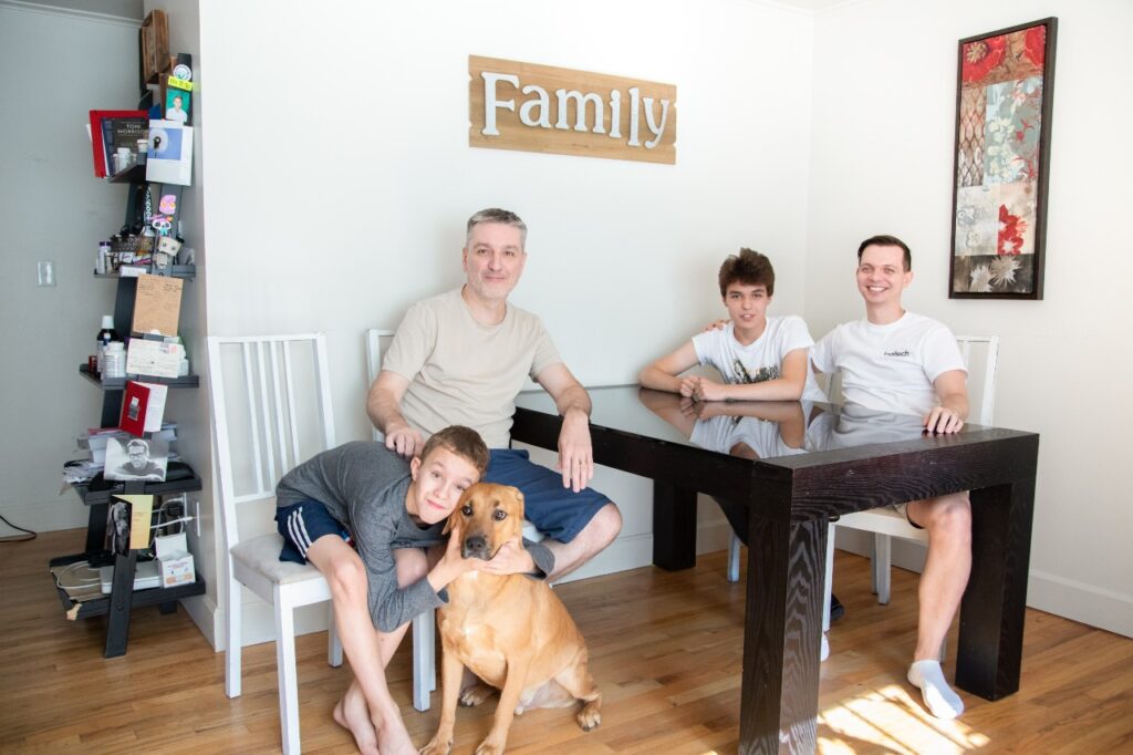 Family photo at dining room table with dog